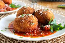 Risotto balls stuffed with meat sauce,fresh mozzarella and peas, coated in a bread crumbs and flash fried in a golden brown served with a side of marinara sauce.
